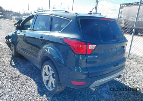 2019 Ford Escape Titanium z USA, uszkodzony, nr VIN 1FMCU9J98KUB43417